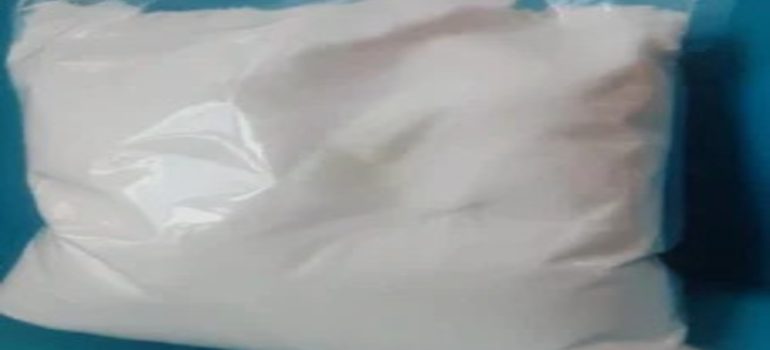 Person using activation powder with SSD chemical to clean black money