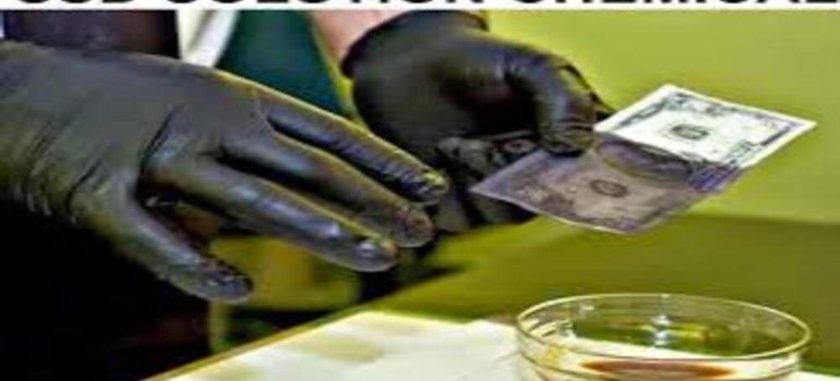 Person cleaning black money with SSD chemical